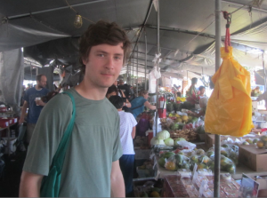 Danila at a veggie market